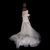 3D Hand embellished organza floral bustier gown with removable puff sleeves.