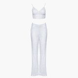 off-white Anastasia Beaded Bralette Crop Top. Handcrafted with intricate beadwork, this versatile party outfit features a lace-up tie closure at the back, ensuring a perfect fit. Stand out at events with this chic and stylish crop top. Shot on ghost with the sequin pants from our collection