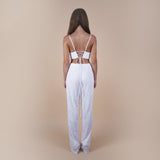 Evan sequin off-white pants are perfect for glamorous nights out, weddings, and special occasions, offering both style and comfort. Elevate your look with these versatile and chic pants. The Back view of the pants.