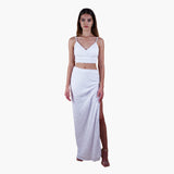 off-white Anastasia Beaded Bralette Crop Top. Handcrafted with intricate beadwork, this versatile party outfit features a lace-up tie closure at the back, ensuring a perfect fit. Stand out at events with this chic and stylish crop top. Styled with sequin high slit front view.