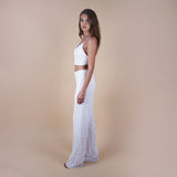 Evan sequin off-white pants are perfect for glamorous nights out, weddings, and special occasions, offering both style and comfort. Elevate your look with these versatile and chic pants. Side view