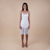  Elevate your fashion game with our Hand-Beaded Sheer Bead Fringe Hem Off-White Midi Dress. Perfect for cocktail parties, weddings, and white-themed events, this luxurious piece exudes sophistication. Intricate hand-beading and a captivating fringe hem ensure you make a statement at every occasion. Front detailed view of the knee length dress.