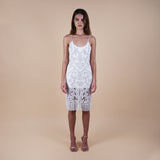 Elevate your fashion game with our Hand-Beaded Sheer Bead Fringe Hem Off-White Midi Dress. Perfect for cocktail parties, weddings, and white-themed events, this luxurious piece exudes sophistication. Intricate hand-beading and a captivating fringe hem ensure you make a statement at every occasion. Front detailed view of the knee length dress.