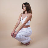 Evan sequin off-white pants are perfect for glamorous nights out, weddings, and special occasions, offering both style and comfort. Elevate your look with these versatile and chic pants. Show with Anastasia crop top