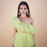 Close up of tulle ruffled off the shoulder dress