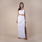 Giselle Off-White Sequin Maxi Long Skirt. Perfect for a boho look, nights out, weddings, brides, white parties and spring transitions. Handcrafted with intricate sequin embellishments, this skirt adds glamour to any occasion. Indulge midi skirts, high waisted skirt, skirt with a slit, long skirt. With Anastasia Bra Top front side showing the side slit