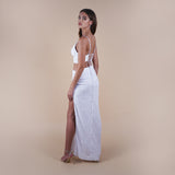 Giselle Off-White Sequin Maxi Long Skirt. Perfect for a boho look, nights out, weddings, brides, white parties and spring transitions. Handcrafted with intricate sequin embellishments, this skirt adds glamour to any occasion. Indulge midi skirts, high waisted skirt, skirt with a slit, long skirt. Side view the anastasia bralette top