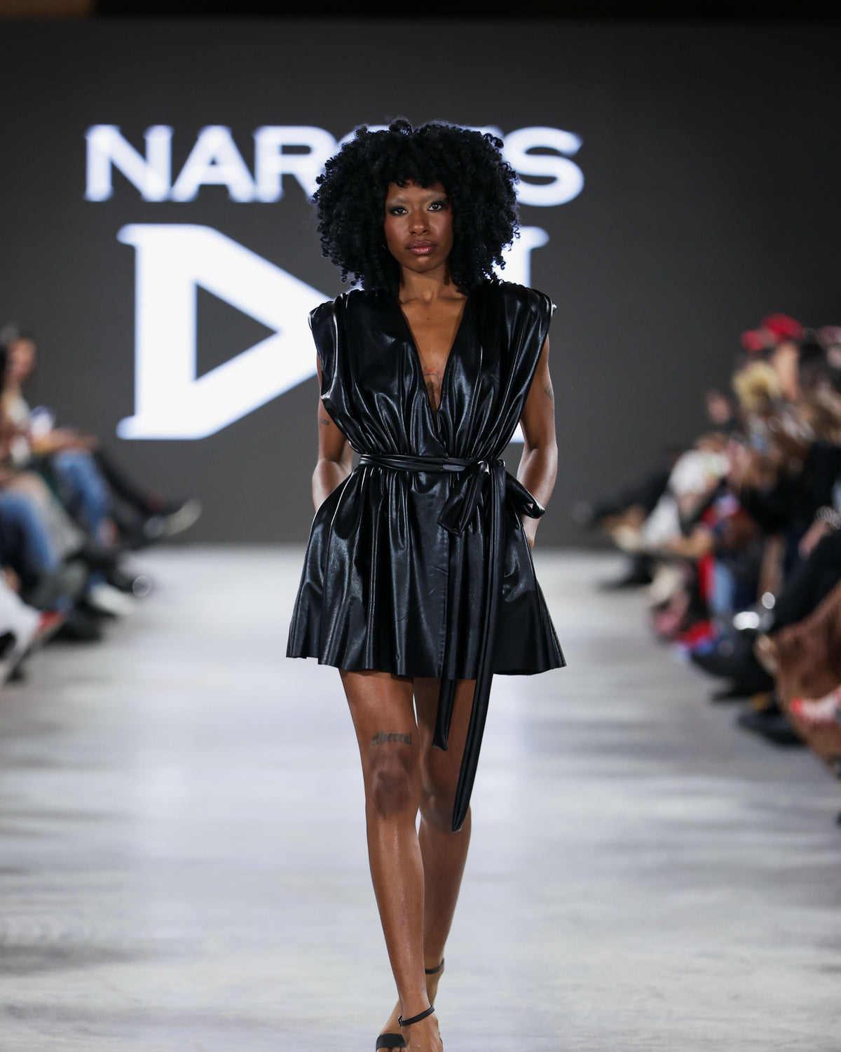 fashion dresses High Low by La Moda | Wholesale Premier Designer Dresses applied crystal embellishments on bodice Subtle reflective mirror detailing Draped satin overlay across hips Defined waist with sculpted contour fit Voluminous gathered skirt construction Soft flowing train Asymmetric draping Model is wearing a size S NARCES | Luxury Designer Dresses