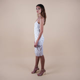 Elevate your fashion game with our Hand-Beaded Sheer Bead Fringe Hem Off-White Midi Dress. Perfect for cocktail parties, weddings, and white-themed events, this luxurious piece exudes sophistication. Intricate hand-beading and a captivating fringe hem ensure you make a statement at every occasion. (Side View)